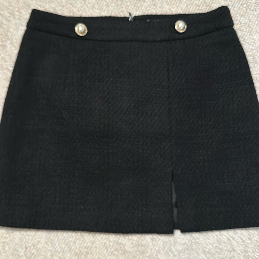 Black mini skirt. Part of a suit